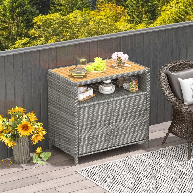 Rattan storage cabinet with acacia wood countertop, featuring a 2-door design, ideal for outdoor patio or poolside use.